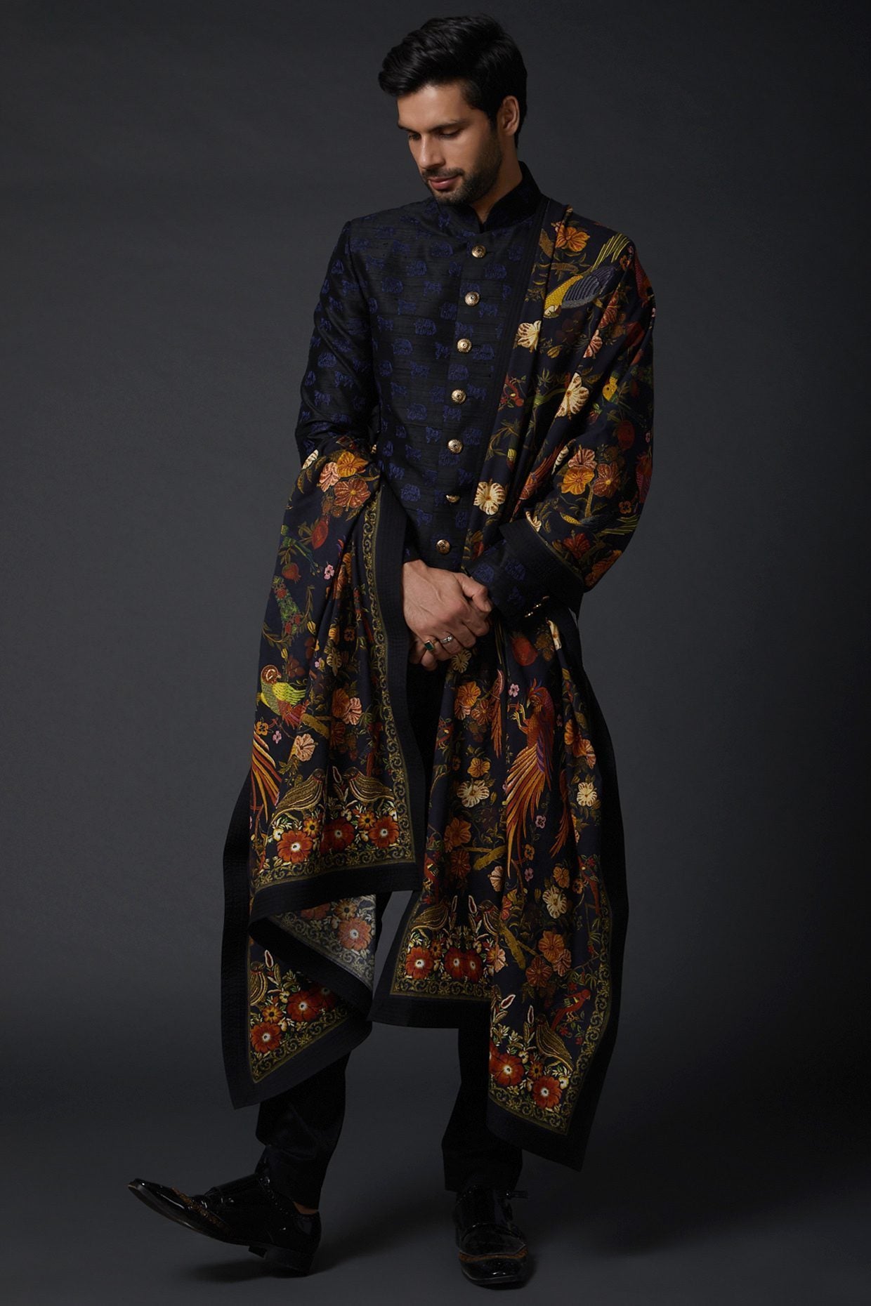 Featuring an indigo blue shawl in khadi base with digital print. This contains only one piece.