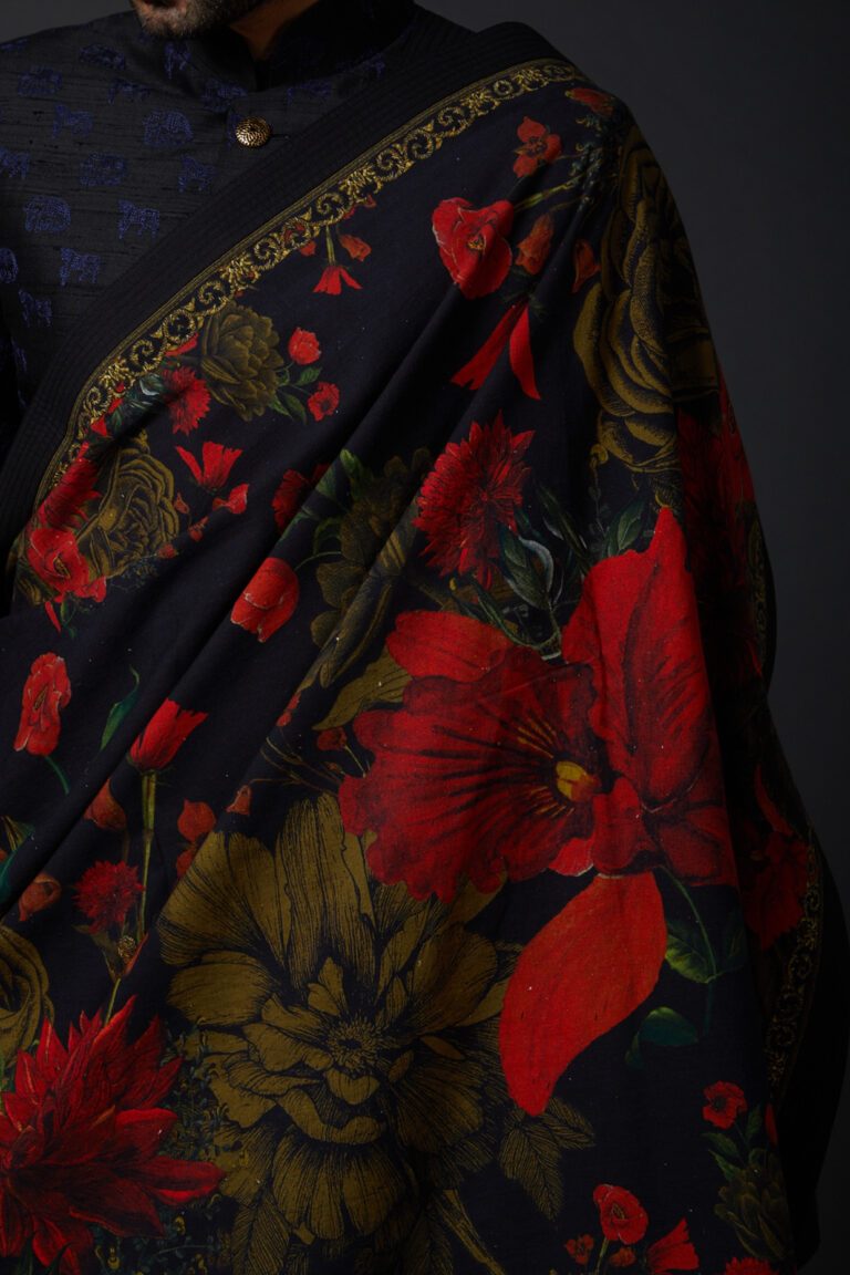 Featuring an indigo blue shawl in khadi base with digital print. This contains only one piece.